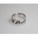 silver ring displaying the word death on it in black