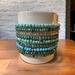 Blue and green stacked bracelet.