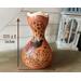 This shows the size of the natural gourd vase. It is 13.75 inches tall and 8 inches wide. The gourd vase decorated a vintage green table.