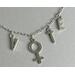 Silver paperclip chain necklace with charms spelling "VOTE" and the venus, female sign in place of the letter "O".