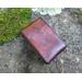 This Premium Handmade Leather Tarot Card Case is individually hand dyed to mimic molten rock - Brimstone is a whirl of Blacks, Grays, and Reds all molten together to create a unique deep red color.