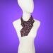 pleated ascot scarf with an african art print.