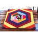 Hexagon shaped design that is completed into a square shaped mat.  Mug rug is multi-colored for a scrappy appearance. 