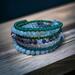 7 rounds of glass beads on memory wire for a plus size bracelet.