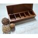 5-compartment in this wooden tea box for organizing tea bags.