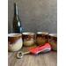 Four brown hand-thrown ceramic wine tumblers, each tumbler holds 12 ounces.