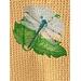 Dragonfly sitting on a leave covers this butter colored microfiber towel