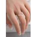 Sterling silver ring with an open circle top modeled on a women's hand.