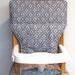 gray Eddie Bauer wooden highchair replacement pad, gray flowers on gray