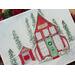 Watercolor and ink art print of Santa's red Workshop decorated for Christmas, featuring a separate building with Santa's sleigh inside. 