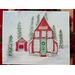 Watercolor and ink art print of Santa's red Workshop decorated for Christmas, featuring a separate building with Santa's sleigh inside. 