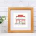 A watercolor and ink print of an old red wooden diner with a blue and white awning. Surfboards, a fishing pole, and a bike sit outside.