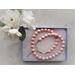 Pink beaded necklace with silver extender and clasp