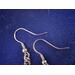 Detail of stainless steel fish hook ear wire.