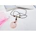Boho style rose quartz necklace on brown leather cord with a stainless steel lobster clasp.