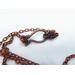 Hook clasp on an antique copper chain