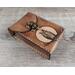 Premium Handmade Leather Tarot Card Case featuring a wise all-seeing owl patiently waiting on a branch in front of the full moon. This high quality leather case has a unique and interesting 3 color finish, with a natural tan moon set against a dark rich brown.
