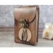 Premium Handmade Leather Tarot Card Case featuring a wise all-seeing owl patiently waiting on a branch in front of the full moon. This high quality leather case has a unique and interesting 3 color finish, with a natural tan moon set against a dark rich brown.