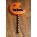 front view horror pumpkin resin lollipop prop - costume prop and decoration orange and black front for cosplayers and Halloween collectors