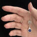 Beautiful Lapis stone is viewed on a flute trill key.  A fleur de lis bail on a  16" silver plated snake chain.