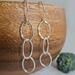 Fine silver triple hoop hammered finish dangle earrings with a sterling silver ear wire.