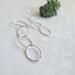 Fine silver triple hoop hammered finish dangle earrings with a sterling silver ear wire.