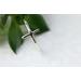 Thin sterling silver ring with a sideways cross.