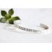 Sterling silver cuff bracelet stamped with Elle Est Forte and Prov 31:25.