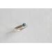 Denim lapis ring with beaded silver band on a wooden surface, showcasing eco-friendly craftsmanship.
