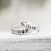  Sterling silver ring with "LUNA" and winged paw print, eucalyptus background.
