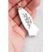 Floral detail on the back of a ocean jasper pendant. 