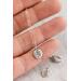 small silver charm made from a recycled silver ball hammered flat and stamped with a fern design on a sterling silver chain.
