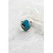Sterling silver ring featuring chunky turquoise free form stone with silvery pyrite inclusions and a floral textured band.