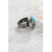 Sterling silver ring featuring chunky turquoise free form stone with silvery pyrite inclusions and a floral textured band.