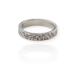 Detailed view of a sterling silver floral ring on white background, emphasizing its unique 4mm texture.
