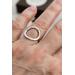 Sterling silver ring with an open circle top, lightly hammered textured finish. 