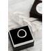 Sterling silver ring with an open circle top, lightly hammered textured finish. 
