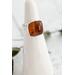 Square Baltic amber cabochon set on a textured organic sterling silver band and bezel.