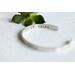 Sterling silver cuff bracelet stamped with Elle Est Forte.