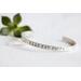 Sterling silver cuff bracelet stamped with Elle Est Forte.