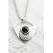 Shield shaped sterling silver pendant with floral patterned moon and faceted black onyx cabochon. 