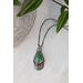  Sterling silver drop necklace with fox turquoise and a floral moon accent. Charm hangs on a sterling silver oxidized square bead chain.
