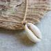 Cowrie shell and leather necklace