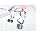 Beaded green jade double-strand necklace with toggle clasp and matching beaded green jade earrings.