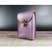 Handmade Premium Leather Tarot Card Case in a purple hue called Violet Cosmos. Standing upright against black background..