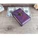 Handmade Premium Leather Tarot Card Case in a purple hue called Violet Cosmos with black hand stitching.