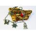 Image is of a Jewish charm bracelet with 4 charms:
Shabbat candles
Star of David
Torah 
Hamsa