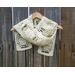 Another pic of a white scarf with snowmen along its length.