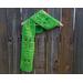 Another pic of a green scarf with tulips along its length.