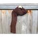 Another pic of a brown scarf with a zig zag pattern.